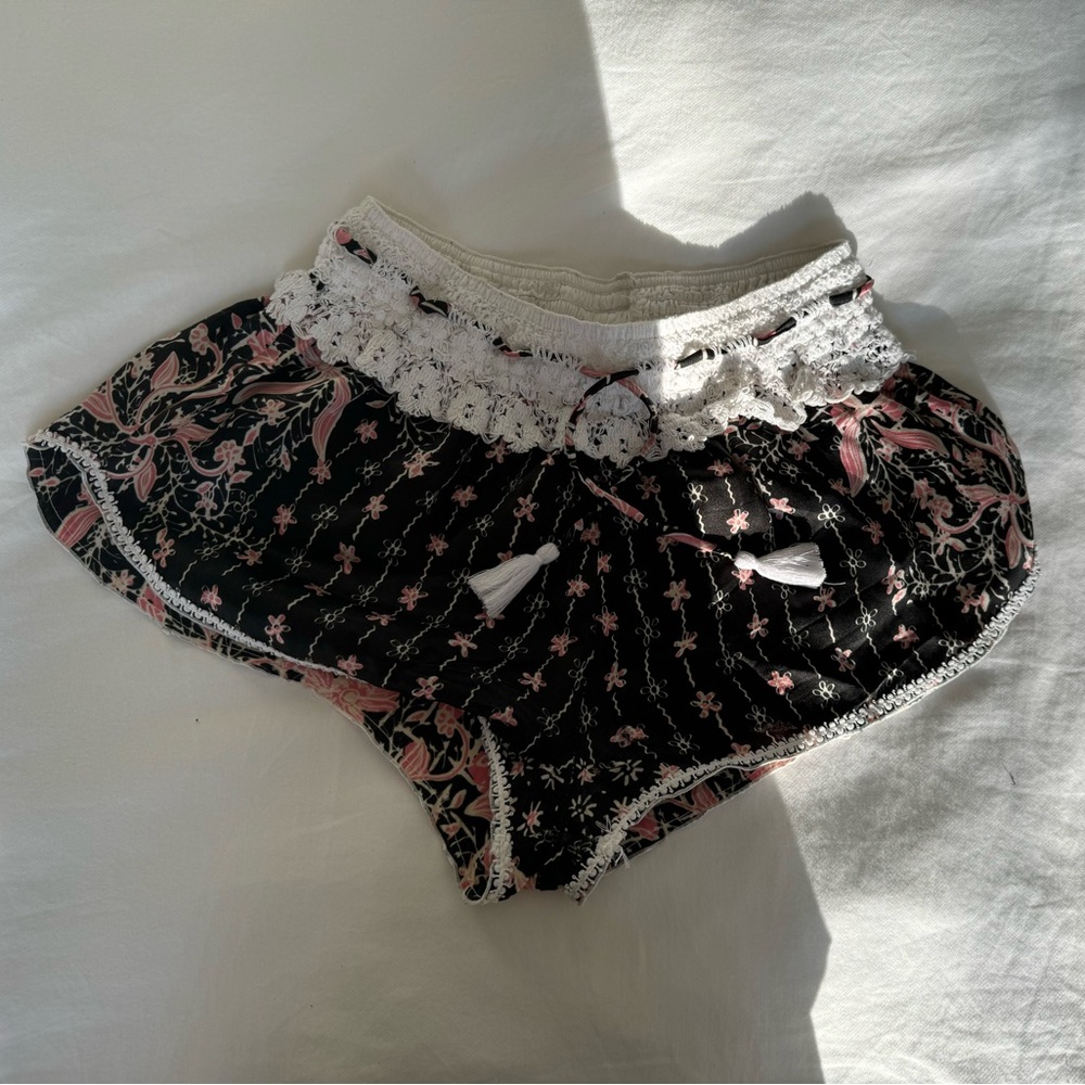 Poupette St Barth silk short shorts with tassel string at waist.